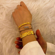 bracelet jonc plume en acier inoxydable plaqué or Fatyna